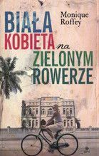 BIAŁA KOBIETA NA ZIELONYM ROWERZE